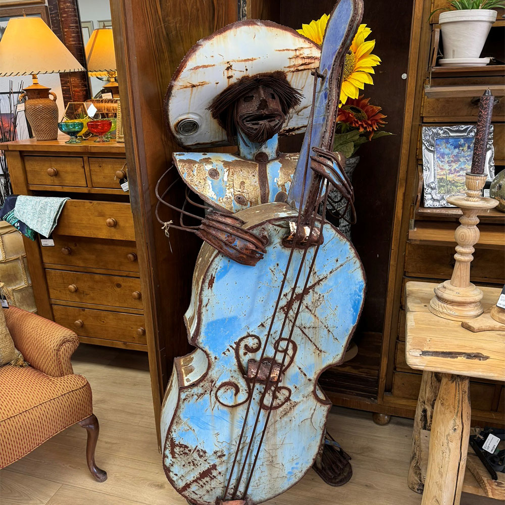 mexican figure playing bass guitar metal yard art